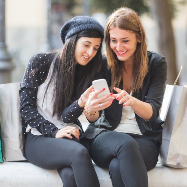 Women shop online with mobile phone