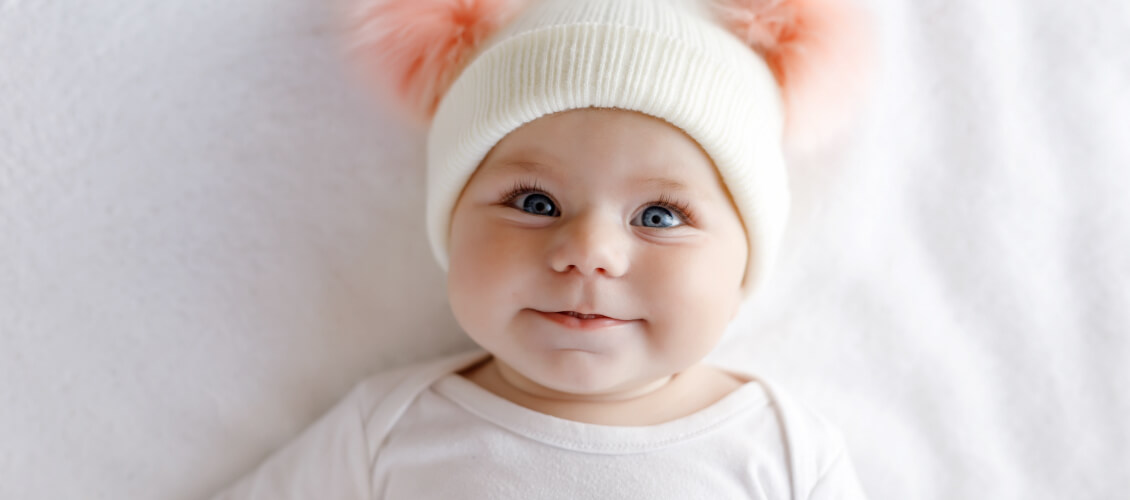 Cute baby in hat.