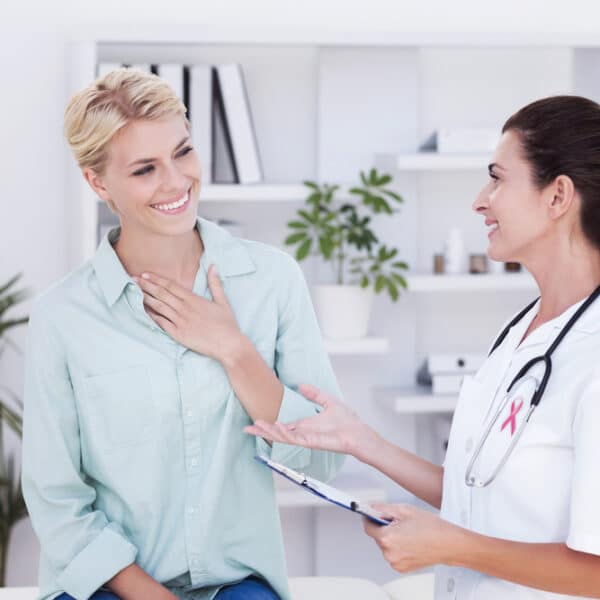 Womens Health Clinic owner chats with patient