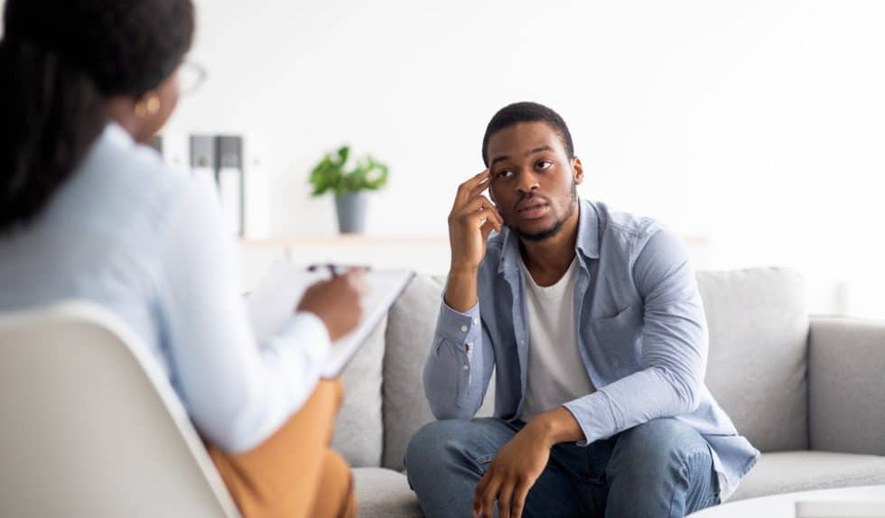 Mental health therapy session with man after choosing to market to men
