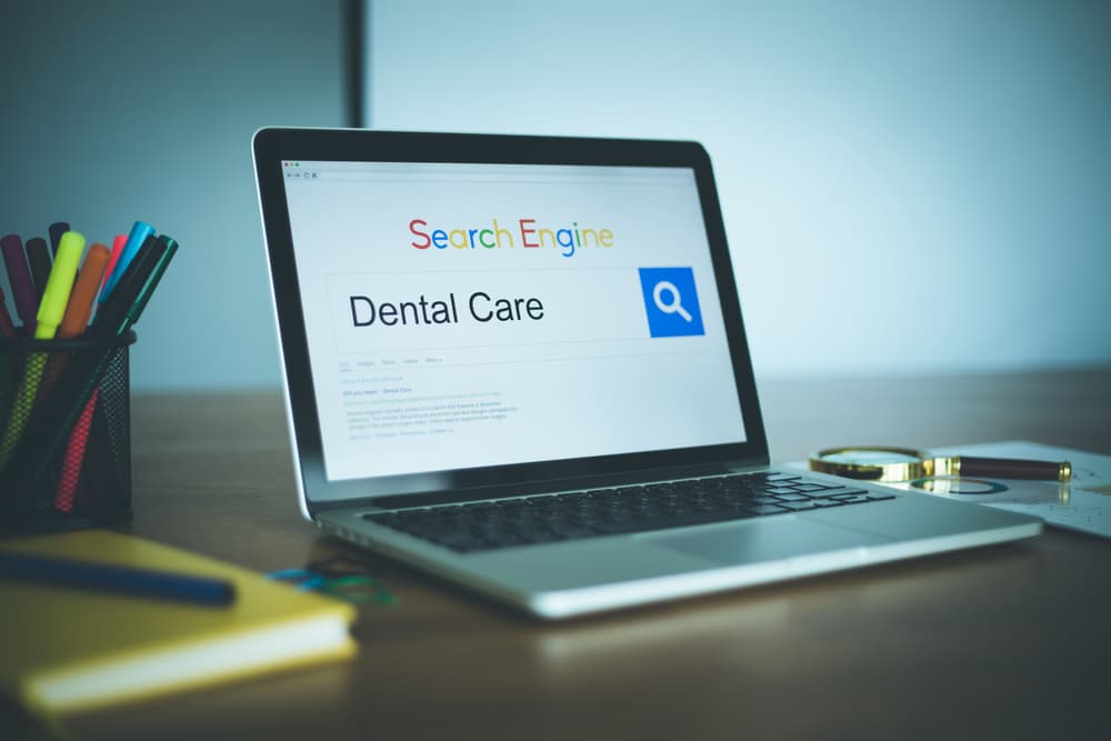 Laptop computer showing SEO search results for dentists