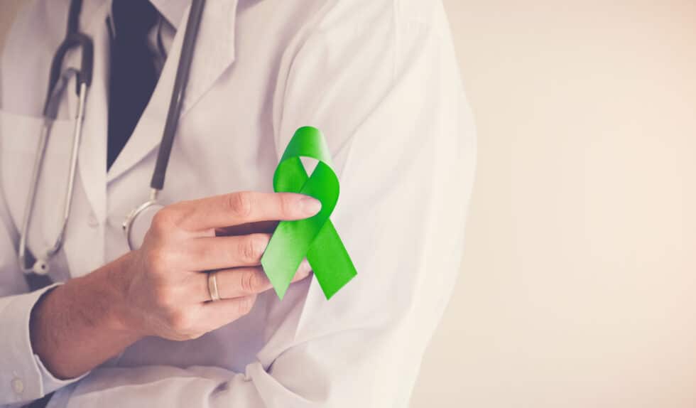 Mental Health provider with green ribbon for Mental Health Awareness Month