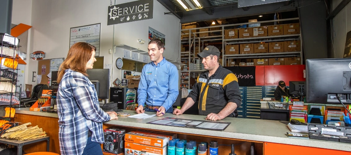 ESI employees help customer at desk