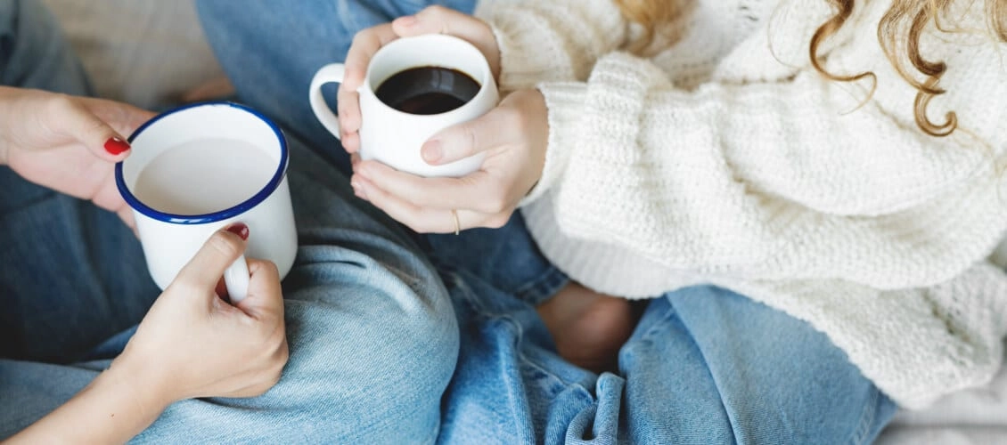 Two women have coffee